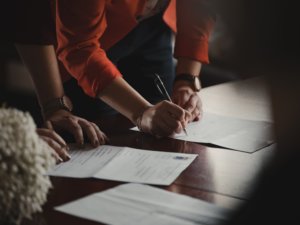 A man signing a document