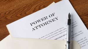 Power of Attorney legal document with a fountain pen on a desk, representing estate planning in Ontario.